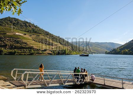 Pinhao, Portugal - October 05, 2018 : Boat Carrying Tourists On The Douro River, Vila Real, Portugal