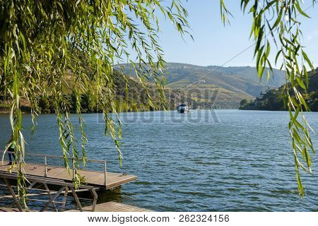 Pinhao, Portugal - October 05, 2018 : Boat Carrying Tourists On The Douro River, Vila Real, Portugal