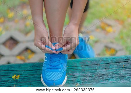 Young Athlete Woman Tying Running Shoes In The Park Outdoor, Female Runner Ready For Jogging On The 