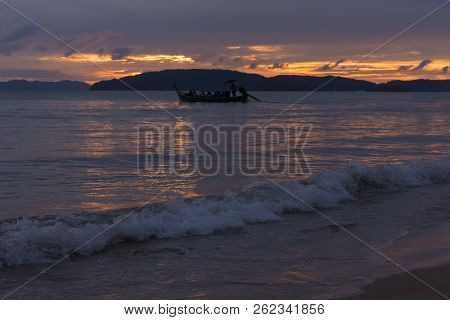 Twilight View Of Waves And Boats