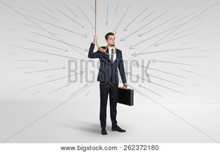 Hopeless young businessman trying to suicide with question signs concept