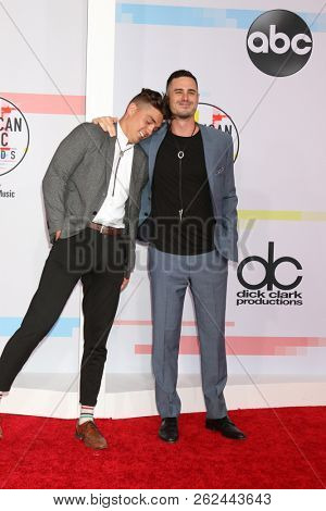 LOS ANGELES - OCT 9:  Dean Unglert, Ben Higgins at the 2018 American Music Awards at the Microsoft Theater on October 9, 2018 in Los Angeles, CA