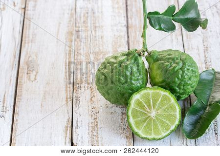Cross Section Bergamot Or Bergamot Slice.close Up Bergamot On Wooden Table Background. With Some Jui
