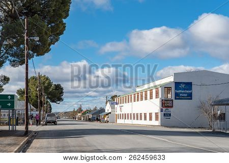 Sutherland, South Africa, August 7, 2018: A Street Scene, With Businesses, People And Vehicles, In S
