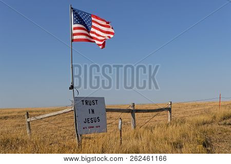 Union Center, South Dakota, September 7, 2018 : Star Splanged Banner Flag And A Message Over The Cou