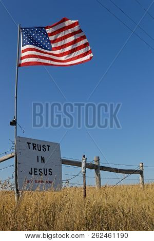 Union Center, South Dakota, September 7, 2018 : Star Splanged Banner Flag And A Message Over The Cou