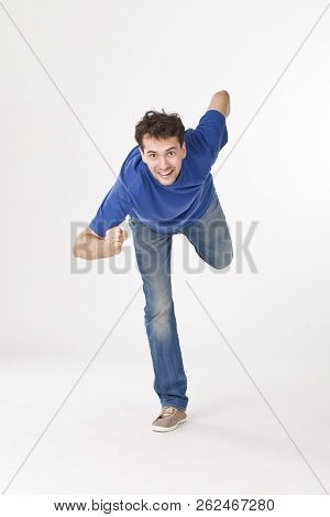 Joyful Boy Posing Like Running Guy, Isolated On White