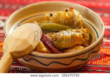 Meat Rolls Sarmale In Clay Bowl With Wooden Spoon