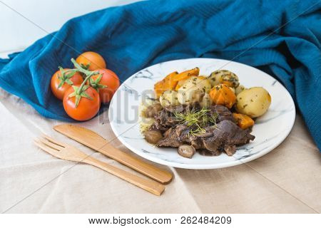 Beef meat stewed with potatoes-Traditional French cuisine Beef Bourguignon potatoes carrots in persillade