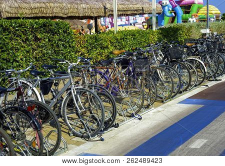 Montesilvano (pe), Italy - July 30, 2017: Bicycles Parked In Front Of A Beach Lido In Montesilvano, 