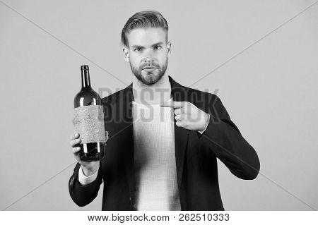 You Should Try This. Man Holds Bottle Alcohol Drink. Social And Cultural Aspects Of Drinking. Busine