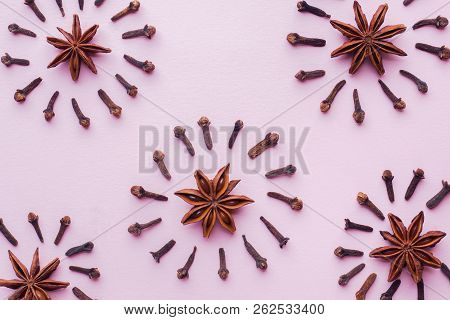 Composition Of Star Anise And Cloves On Pink Background. Abstrac
