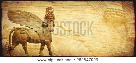 Grunge background with paper texture and lamassu - human-headed winged bull statue, Assyrian protective deity. Copy space for text. Mock up template