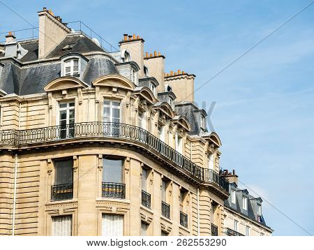 Typical Parisian Architecture In Central Paris With Luxury Apartments, Big Windows And Mansards