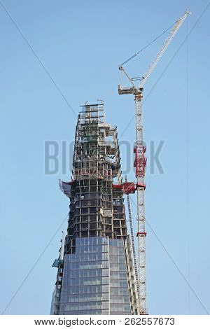 Skyscraper Top With Crane During Final Constructon In London