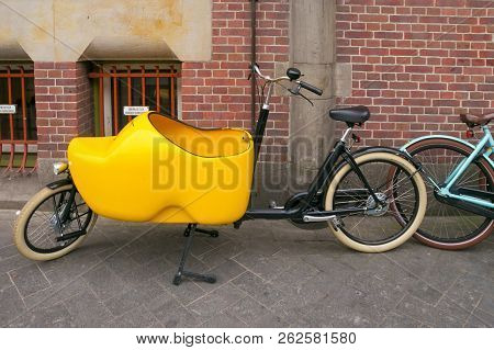 Amsterdam, Netherlands - June 25, 2017: Bicycle With A Cabin In The Form Of Klomp (national Dutch Sh