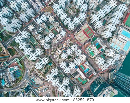 Top view aerial photo from flying drone of a HongKong Global City with development buildings, transportation, energy power infrastructure. Financial and business centers in developed China town