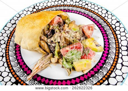 Roll Of Shaverma Bread With Chicken Meat Beef With Greens Tomato Cucumber Mushrooms White, In Sauce 