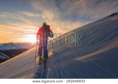 Skitouring with amazing view of swiss famous mountains in beautiful winter powder snow of Alps. 