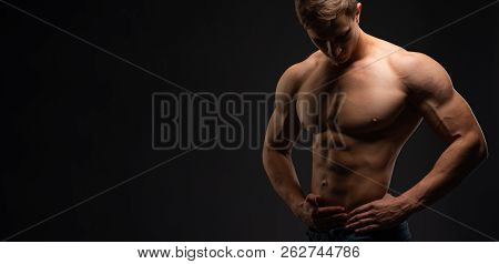 Bodybuilding Concept. Strong Bodybuilder Sports Fitness Man After Bodybuilding Training, Copy Space.