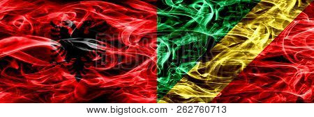 Albania Vs Congo, Congolese Smoke Flags Placed Side By Side. Thick Colored Silky Smoke Flags Of Alba