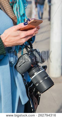 Photographer Hands With Smartphone And  Camera In The Street Photo Shooting Process.
