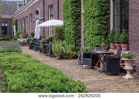 The Almshouse The Green Garden In The Old Center Of Haarlem In The Netherlands
