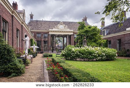 The Entrance Of The Almshouse The Green Garden In The Old Center Of Haarlem In The Netherlands
