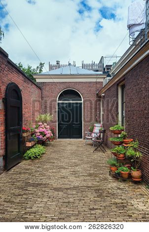 The Almshouse The Green Garden In The Old Center Of Haarlem In The Netherlands