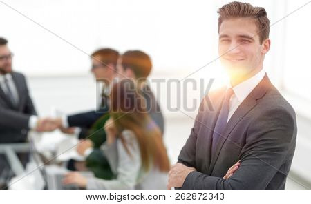 Business partners shaking hands over business objects on workpla