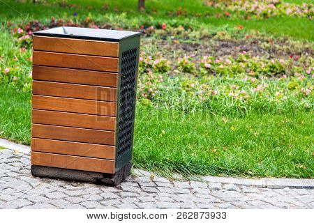 Streer Trash Can In The Metal Case Decorated By Wooden Boards, It Is Established In The Park For Res