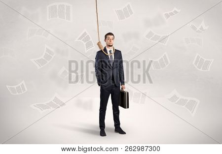 Young burnout businessman with flying documents concept