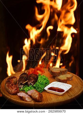 Barbecue Meal Of Shish Kebab And Sausages With Vegetables. Grilled Meat Served With Barbecue Sauce. 