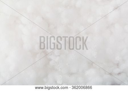 Springy Clean White Hollow Fiber. Holofiber Closeup Texture. Non-woven Synthetic Textile