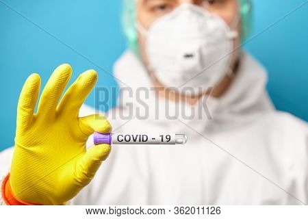 Express Test On Coronavirus. Scientist In Protective Coverall Hold Medical Tube With Test For A Smea