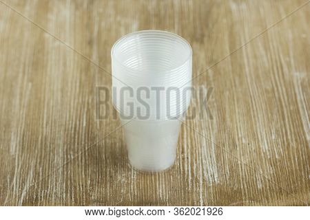 Stack Empty Plastic Glasses Of One Hundred Milliliters For Seedlings And Rooting Cuttings On Wooden 