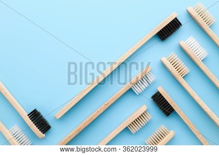 Zero Waste And Without Plastic Concept. Group Of Eco Natural Bamboo Toothbrushes On A Pastel Blue Su