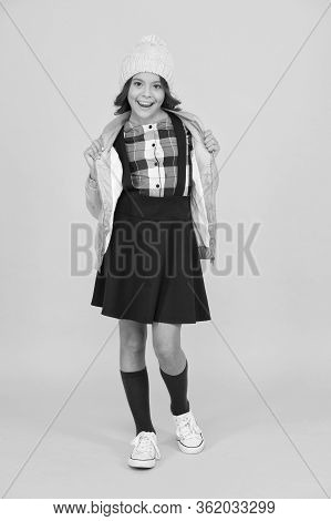 Welcome To School. Small Girl In Uniform. Cheerful Child Yellow Background. Beauty And Fashion For K