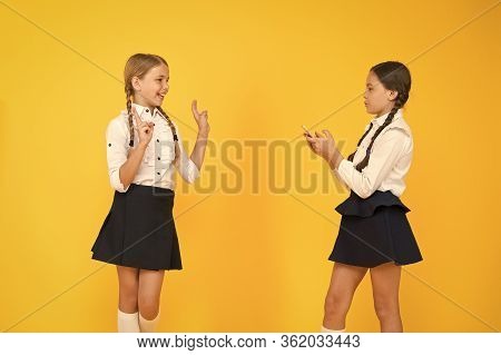 School Application Smartphone. Schoolgirls Use Mobile Phone Or Smartphone To Share Photos. Internet 