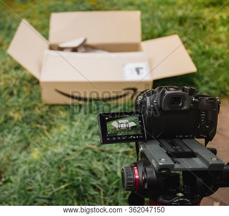 Paris, France - Feb 23, 2020: Vlogger Setup For Unboxing Process From Amazon Prime E-commerce Retail