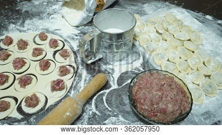 Meat Dumplings - Russian Pelmeni On Wooden Background