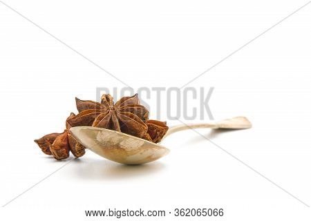 Whole Seed Pods Of Star Anise In A Tarnished Vintage Antique Spoon On A White Background With Ample 