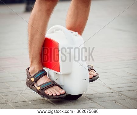 Young Man Driving On Solowheel In The Park.