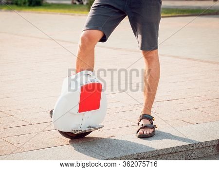 Young Man Driving On Solowheel In The Park.