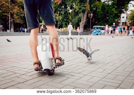 Young Man Driving On Solowheel In The Park.