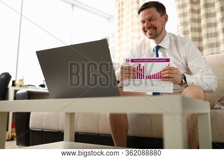 Man Without Trousers Shows Report In Front Laptop. Remote Team Management. Properly Organized Commun
