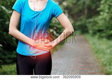 Side Pain - Woman Runner Side Cramps After Running. Jogging Woman With Stomach Side Pain After Joggi