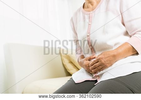 Stomach Pain Of Old Woman At Home, Healthcare Problem Of Senior Concept