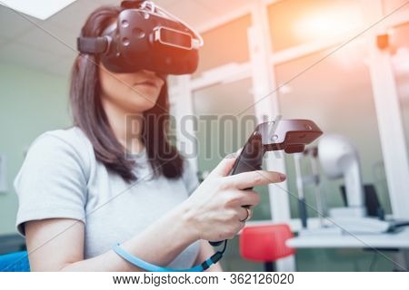 Eye Treatment. Patient In Virtual Reality Goggles.