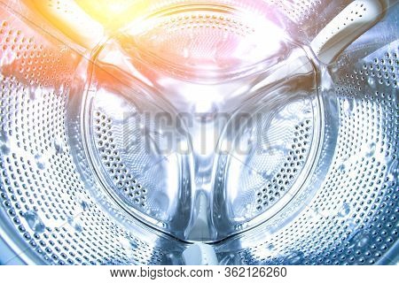 Inside The Drum Of The Washing Machine. Steel Drum Open. Closeup. Washing Machine Drum Background Wi